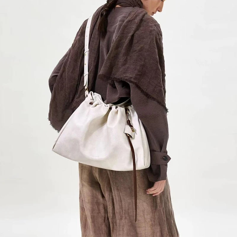 White Leather Bucket Bag with Braided Handle and Adjustable Strap