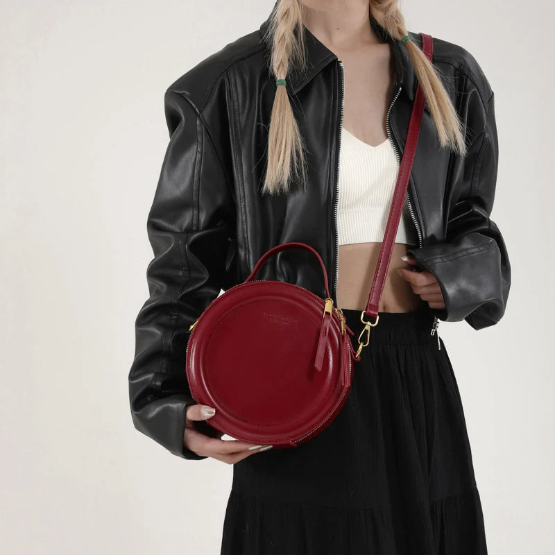 Leather Round Crossbody Bag with Gold Zipper and Adjustable Strap