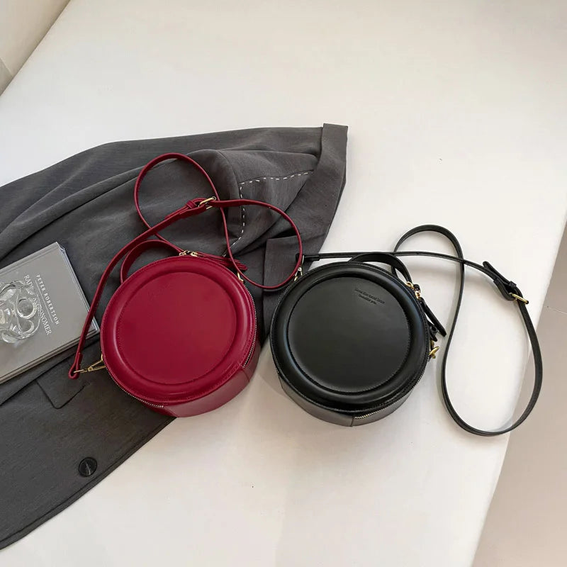 Leather Round Crossbody Bag with Gold Zipper and Adjustable Strap