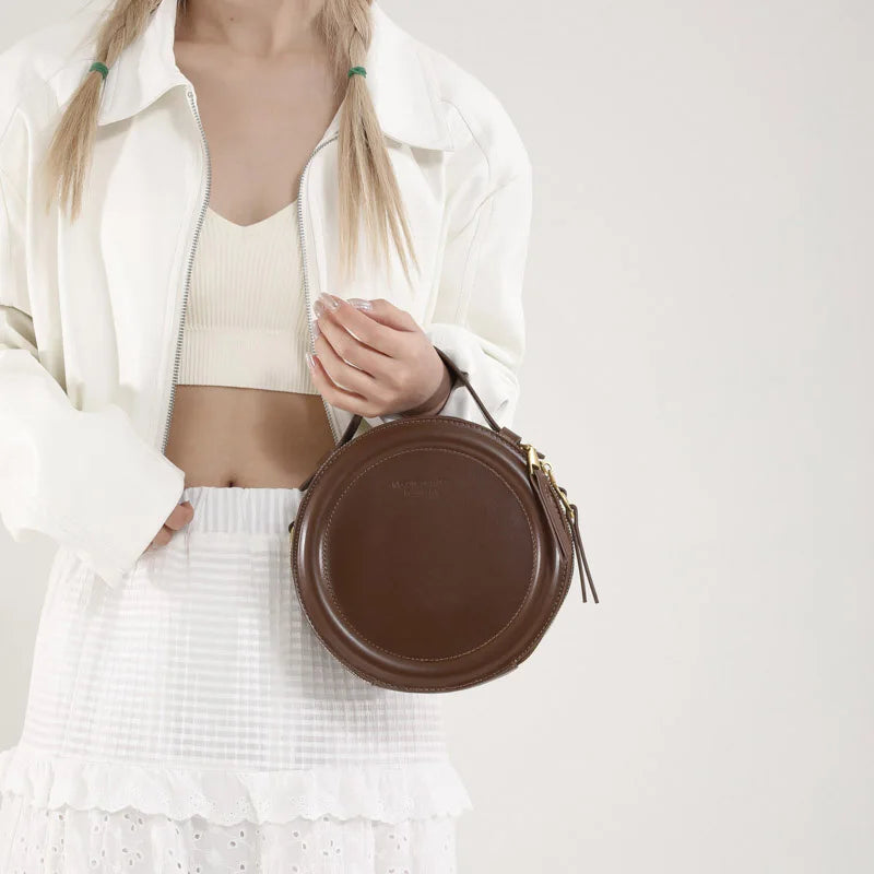 Leather Round Crossbody Bag with Gold Zipper and Adjustable Strap