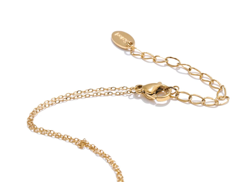 Gold chain bracelet with clasp on a white background