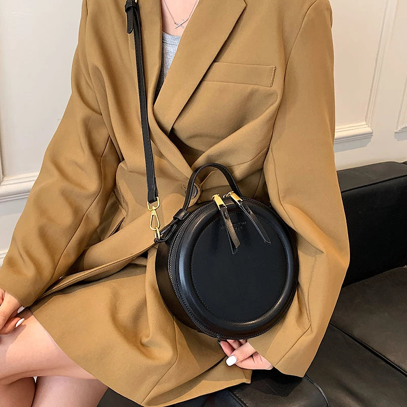 Leather Round Crossbody Bag with Gold Zipper and Adjustable Strap