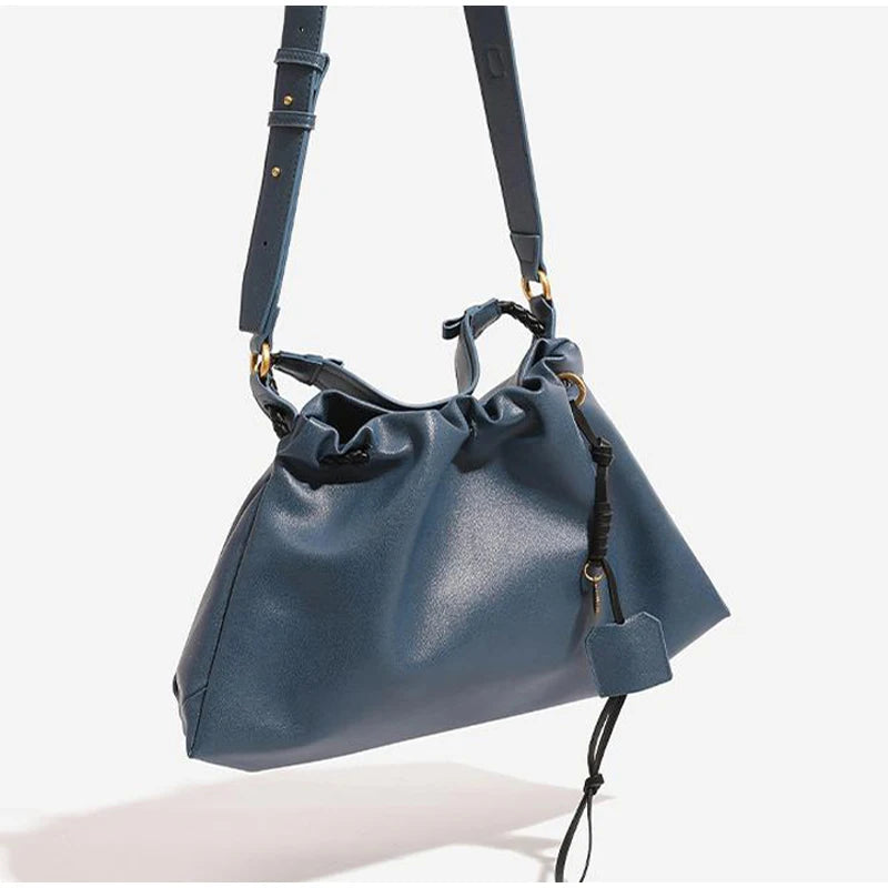 White Leather Bucket Bag with Braided Handle and Adjustable Strap