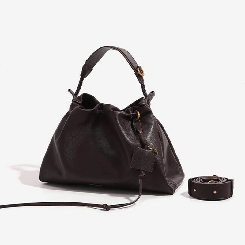 White Leather Bucket Bag with Braided Handle and Adjustable Strap