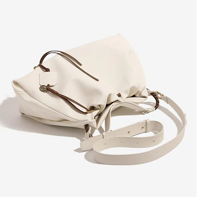 White Leather Bucket Bag with Braided Handle and Adjustable Strap