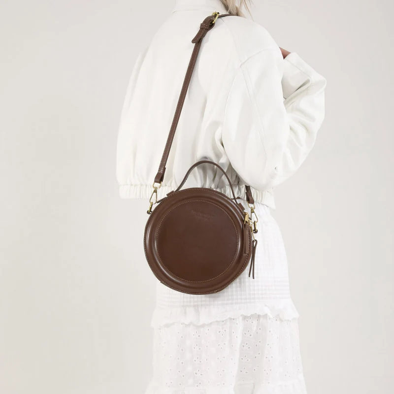Leather Round Crossbody Bag with Gold Zipper and Adjustable Strap
