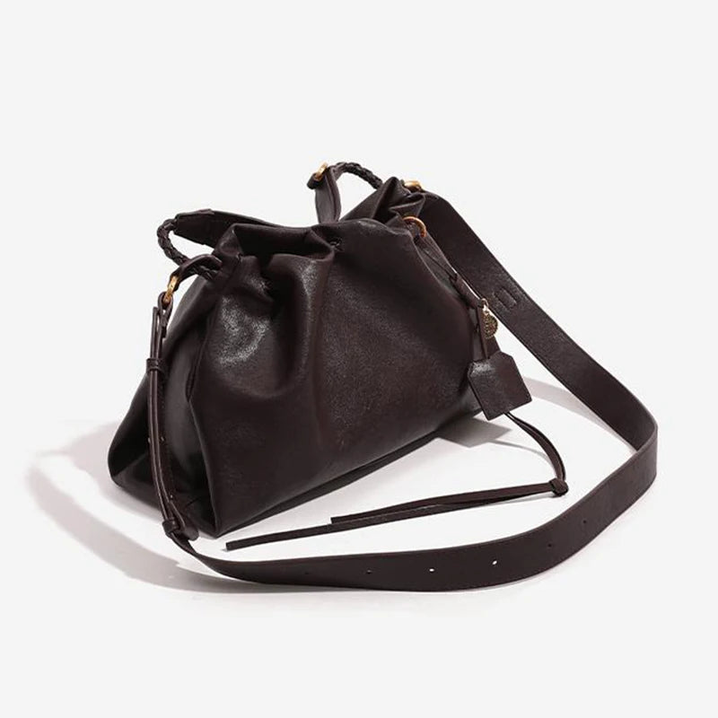 White Leather Bucket Bag with Braided Handle and Adjustable Strap