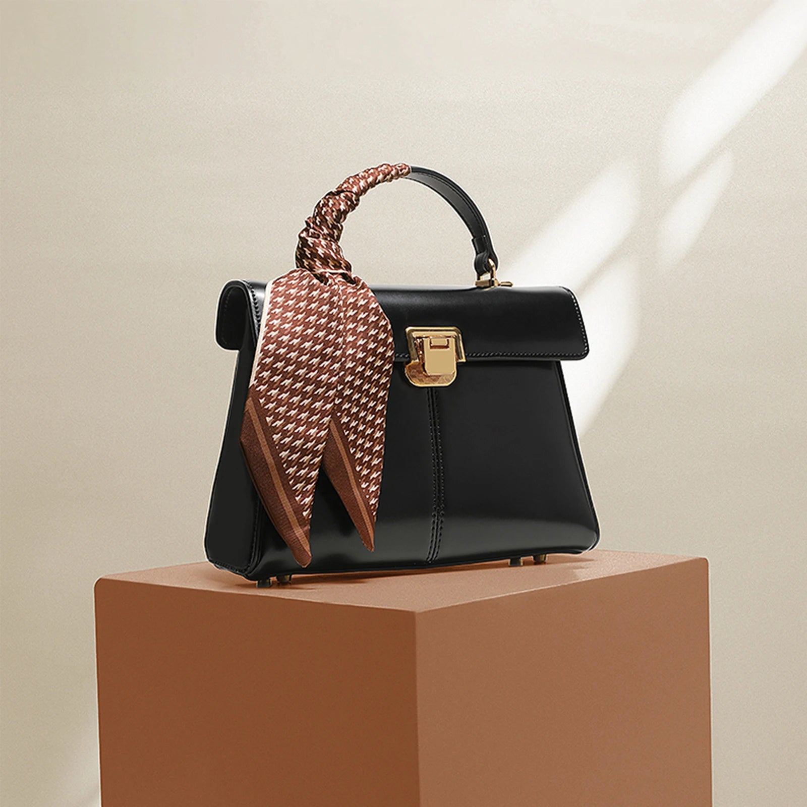 Genuine Leather Handbag with Gold Lock and Adjustable Strap