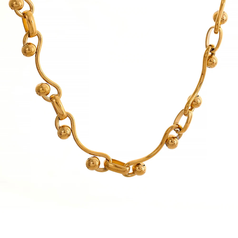 Gold chain necklace on a white background