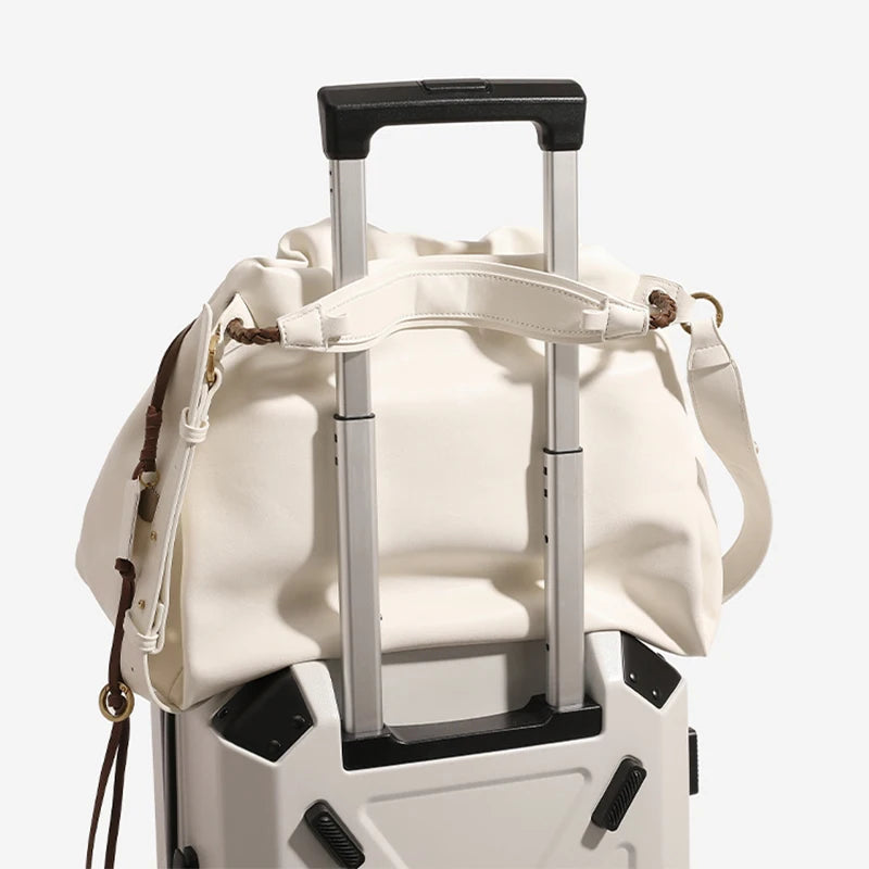 White Leather Bucket Bag with Braided Handle and Adjustable Strap