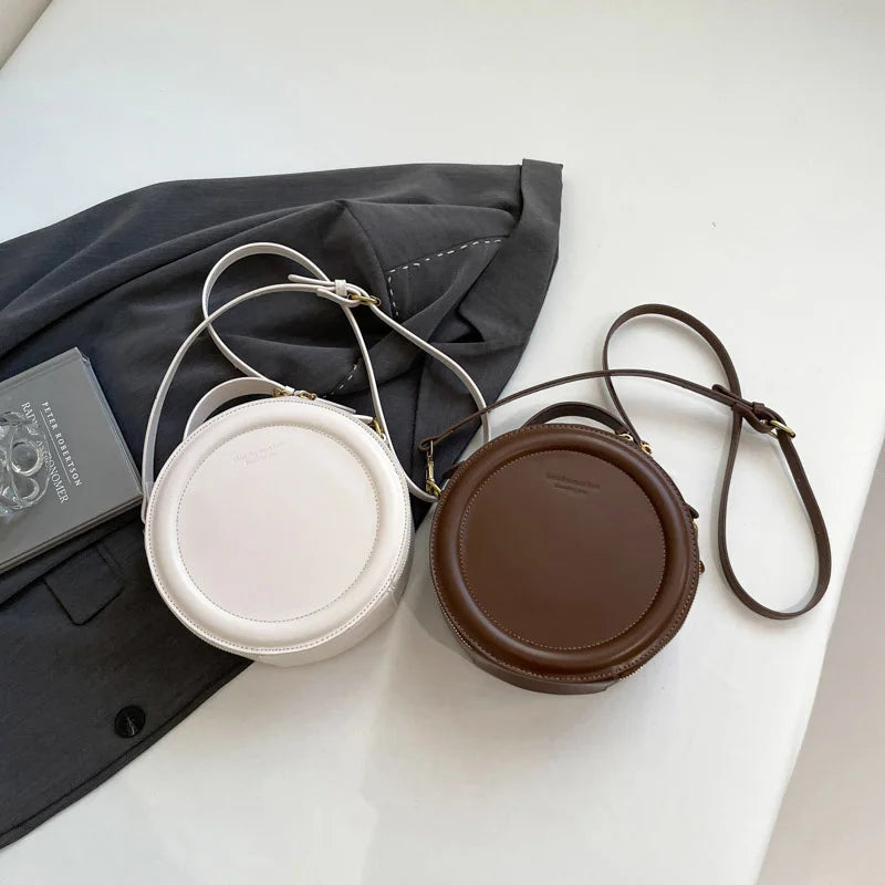 Leather Round Crossbody Bag with Gold Zipper and Adjustable Strap
