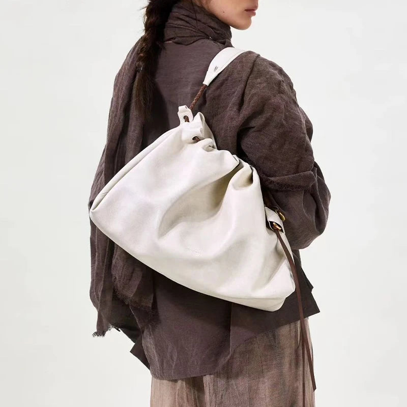 White Leather Bucket Bag with Braided Handle and Adjustable Strap
