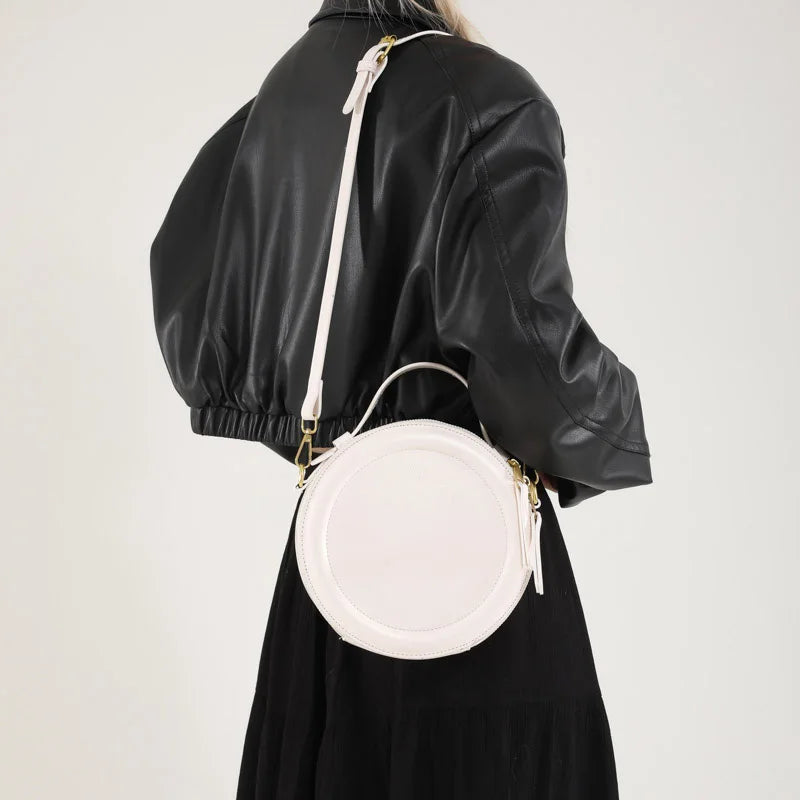 Leather Round Crossbody Bag with Gold Zipper and Adjustable Strap