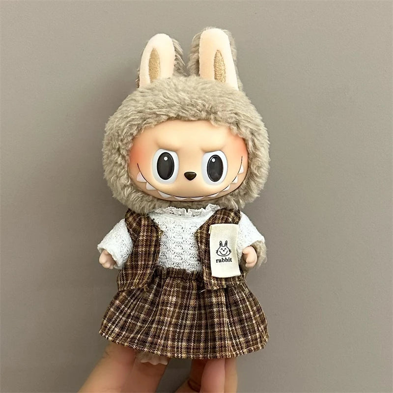 labubu Toy figure with rabbit ears and a plaid outfit on a plain background