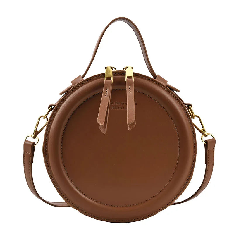 Leather Round Crossbody Bag with Gold Zipper and Adjustable Strap