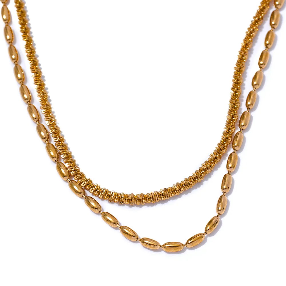 Two gold beaded necklaces on a white background