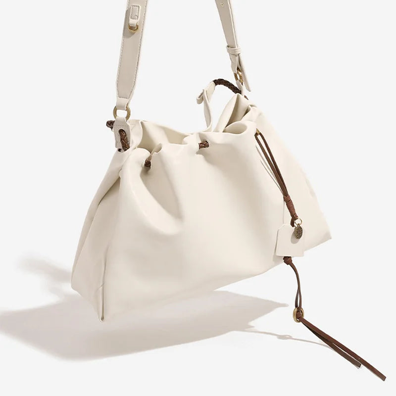 White Leather Bucket Bag with Braided Handle and Adjustable Strap