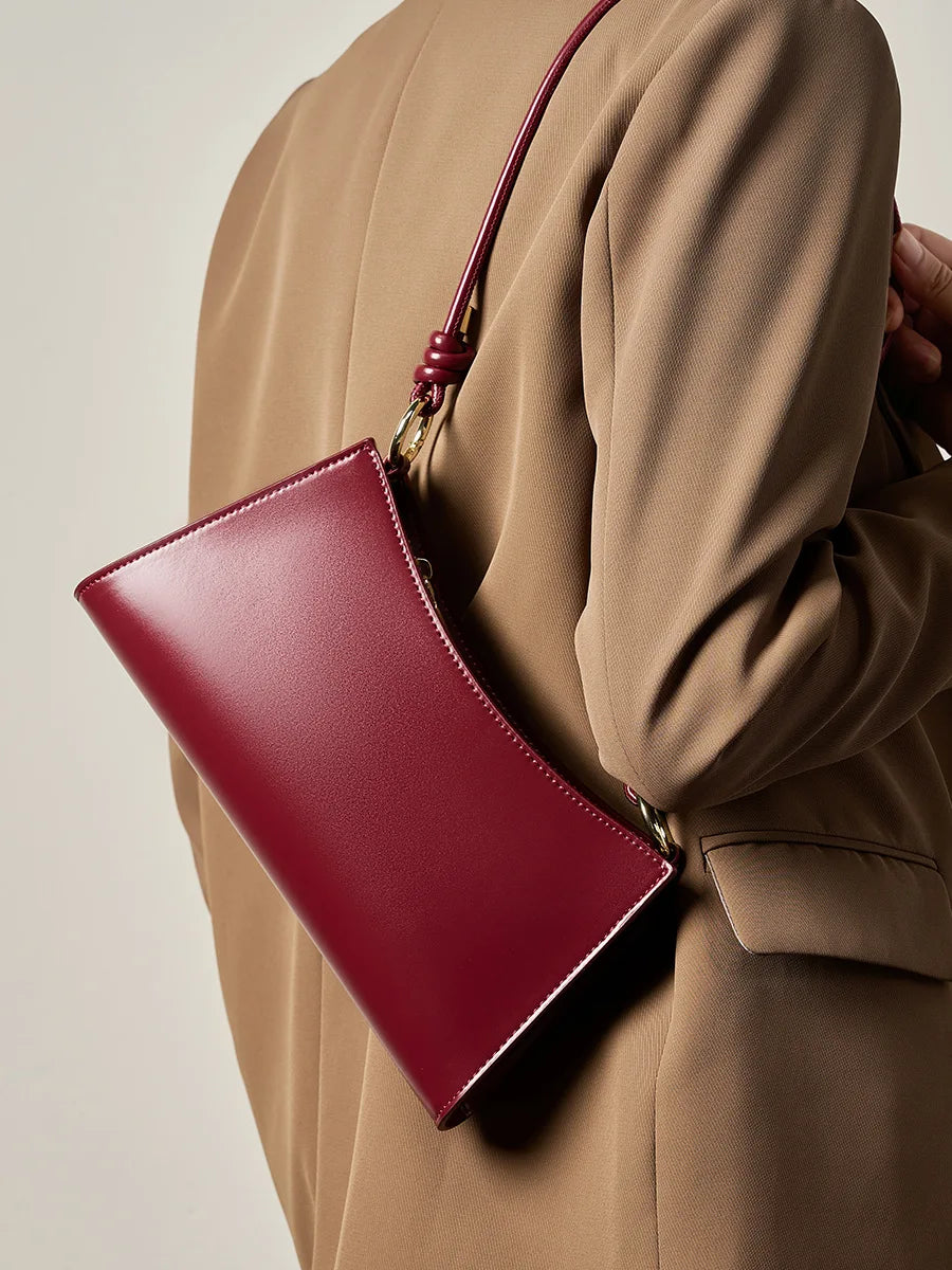 Genuine Leather Handbag with Knotted Strap and Gold Hardware