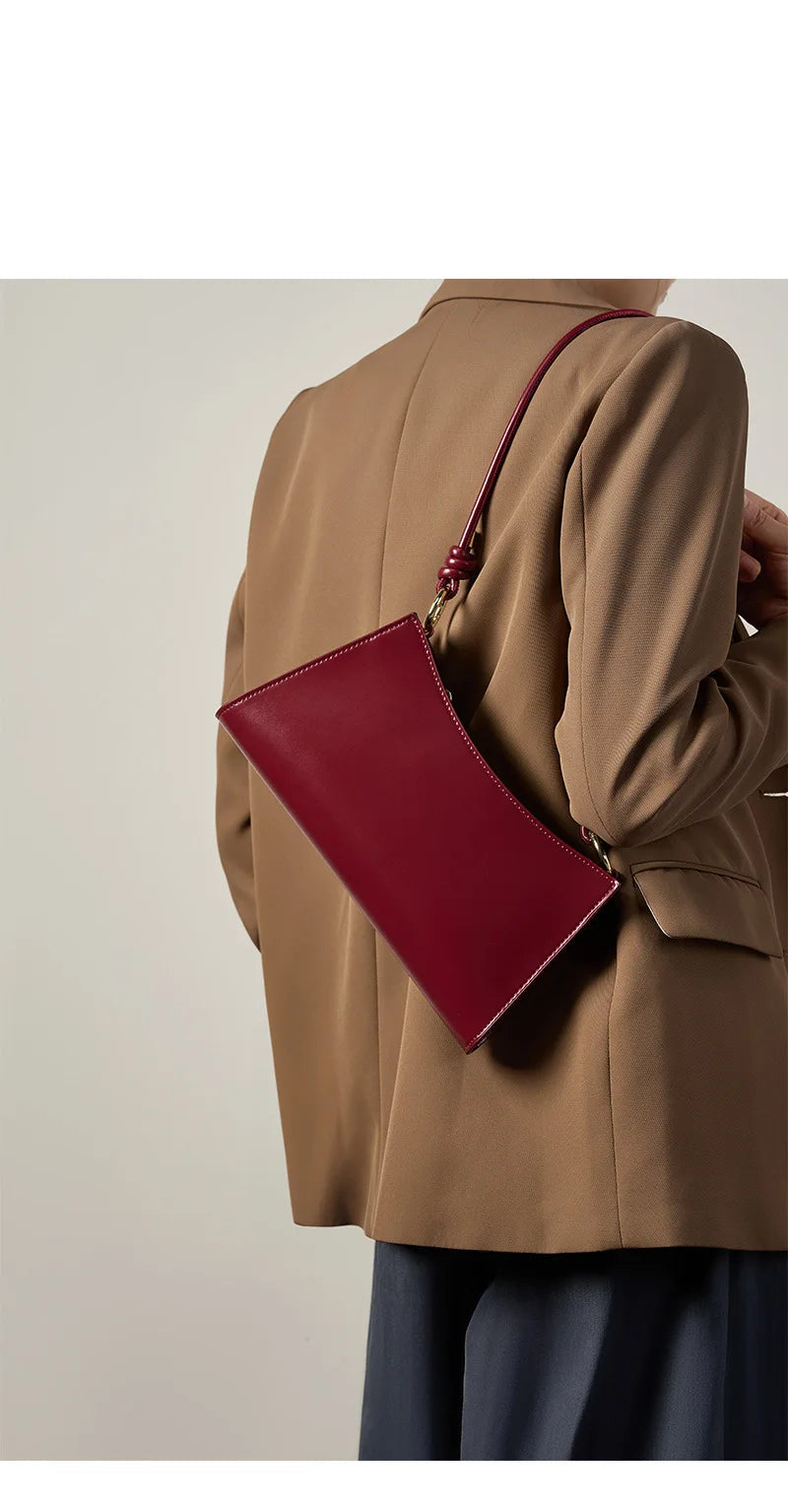 Genuine Leather Handbag with Knotted Strap and Gold Hardware
